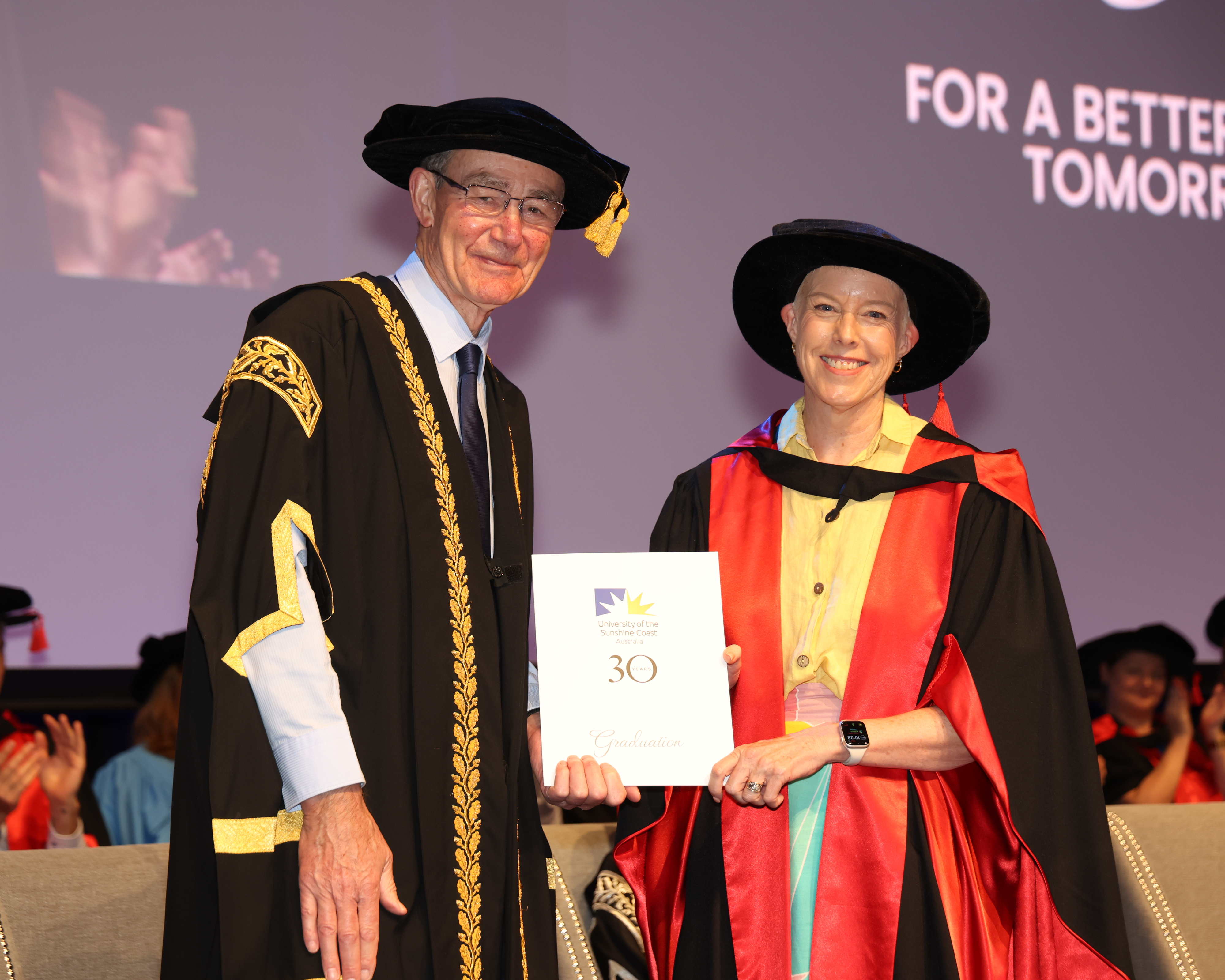 Dr Sandra Elsom receiving her doctoral degree at UniSC graduation, 2026